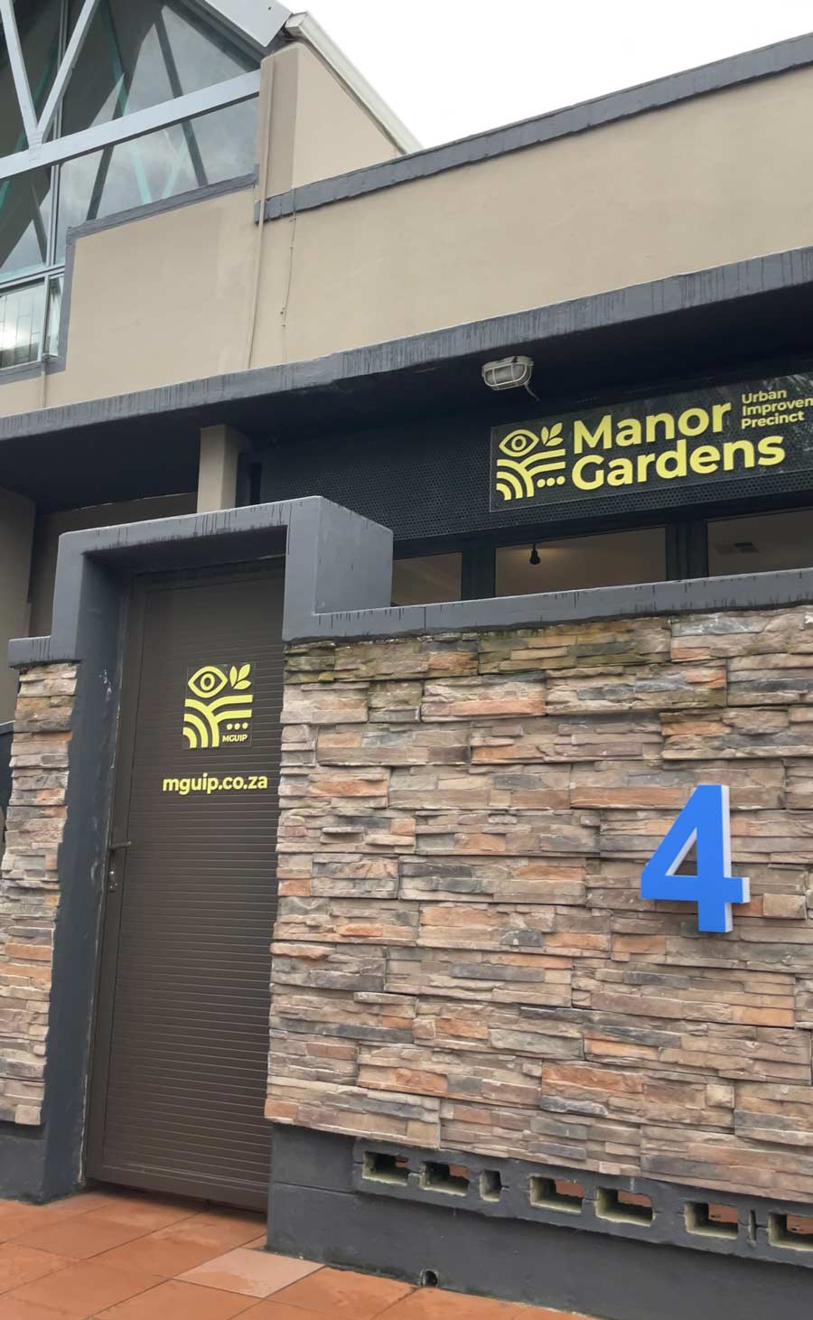 The MGUIP office at 4 Elland Road, Westridge. Stone-clad entrance with the Manor Gardens Urban Improvement Precinct signage